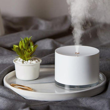 White minimalist humidifier lamp on a white tray