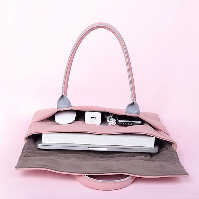 Waterproof pink laptop bag with gadgets inside