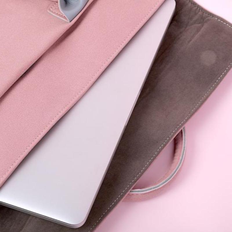 pink vegan laptop bag with laptop inside