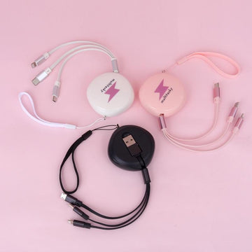 Retractable multi phone charger cable in pink, white, and black