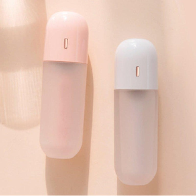 Portable mini humidifier in pink and white