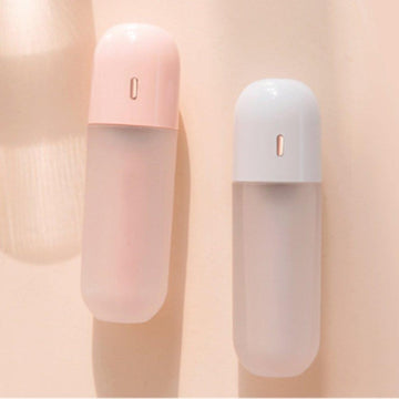 Portable mini humidifier in pink and white