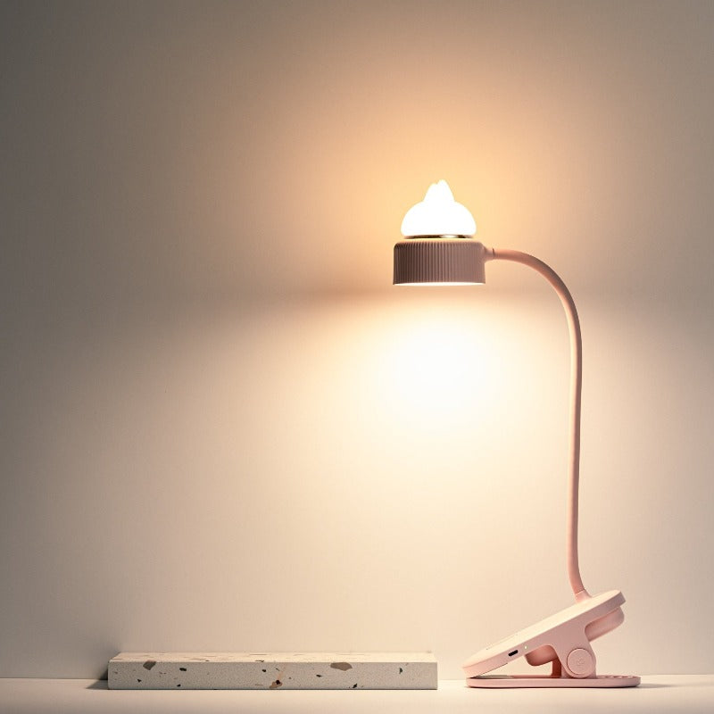 Pink clip on reading lamp that bends with cat ears on top