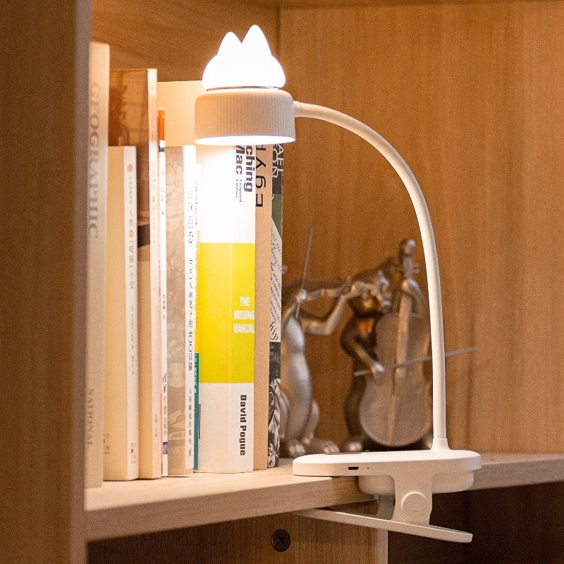 White clip on reading lamp that bends with cat ears on top