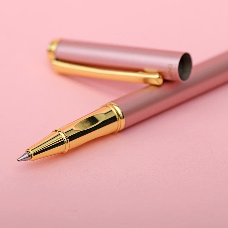 The ballpoint tip of custom metal pen in pink