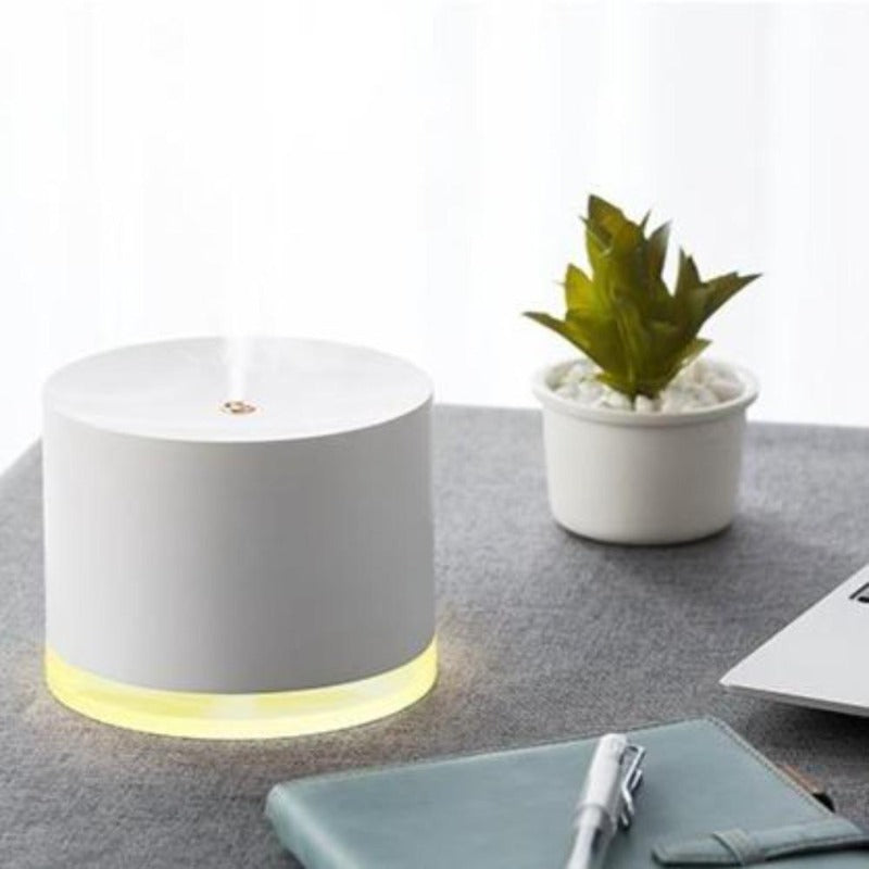 White minimalist humidifier lamp on a desk