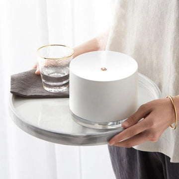 White minimalist humidifier lamp on a white tray