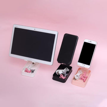 Minimalist phone stand in pink, white, and black