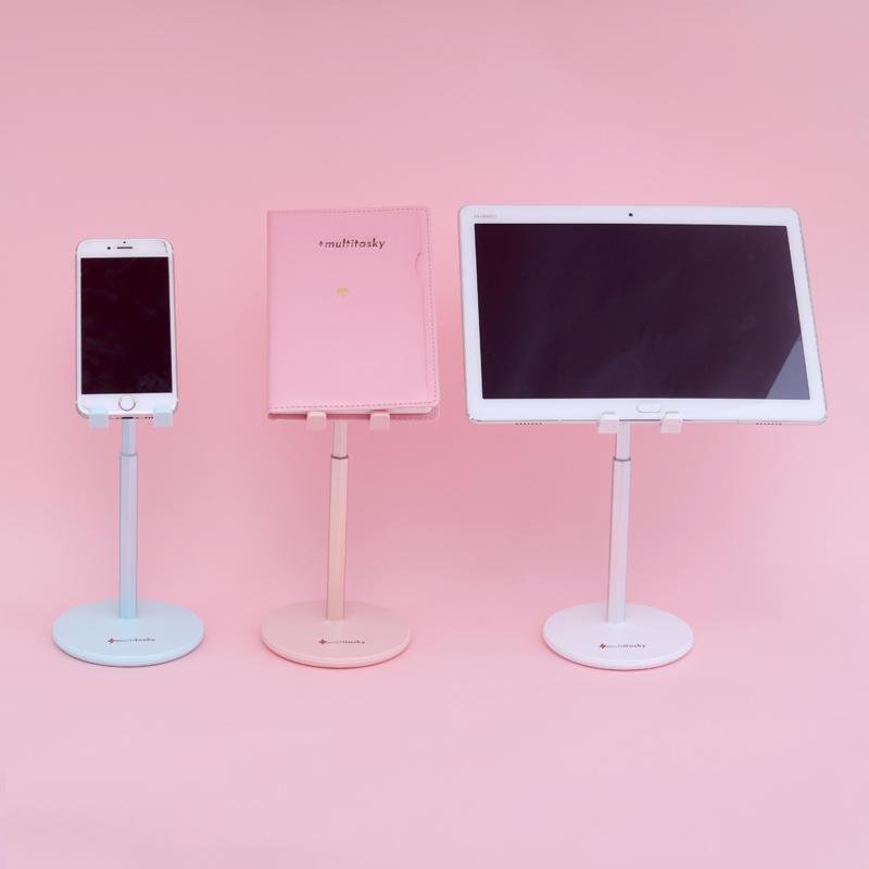Adjustable cell phone stand for desk in pink, white, and blue