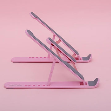 Foldable laptop stand in pink - side view