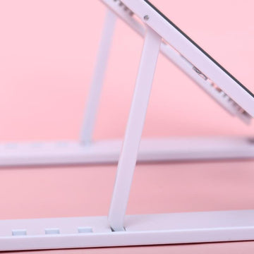 Foldable laptop stand in white