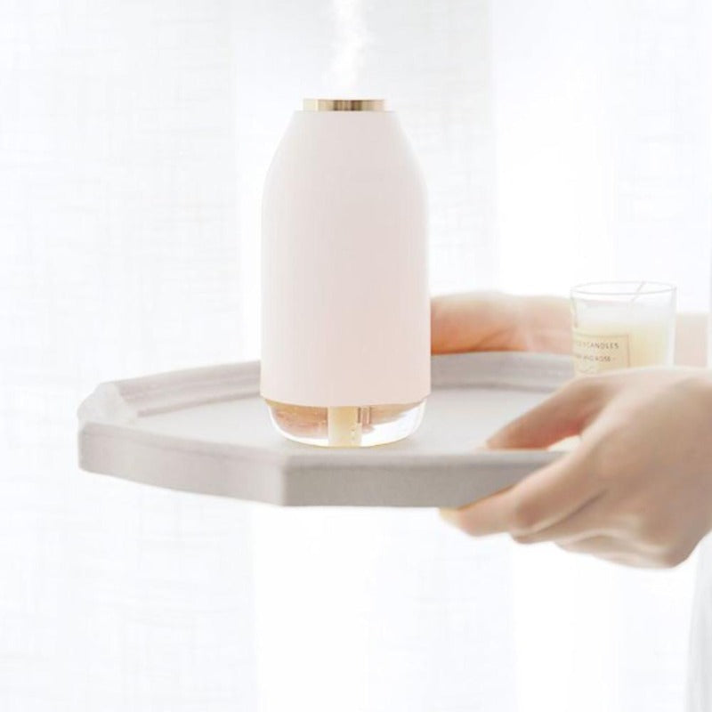 Decorative spa humidifier lamp in white on a tray