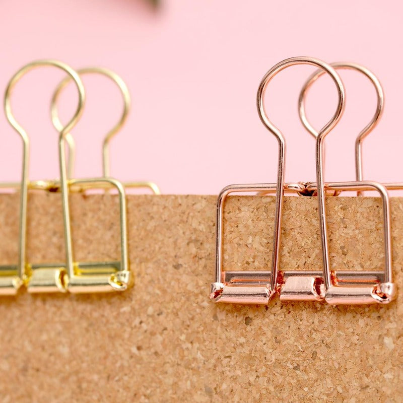 Minimalist binder clips on standing cork board