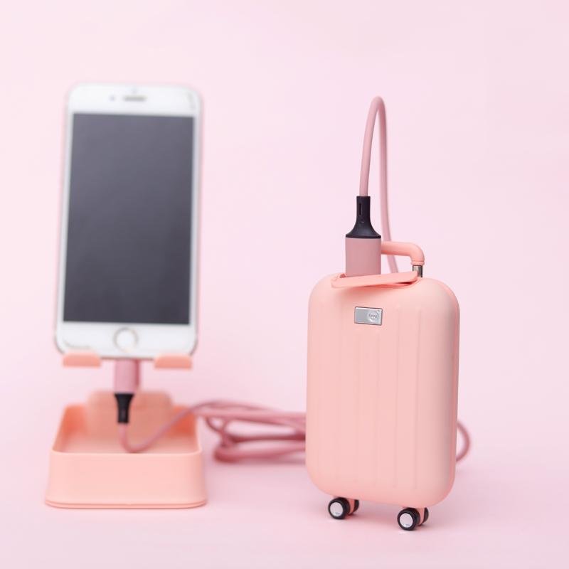 Traveler power bank with hand warmer shaped like a suitcase in pink