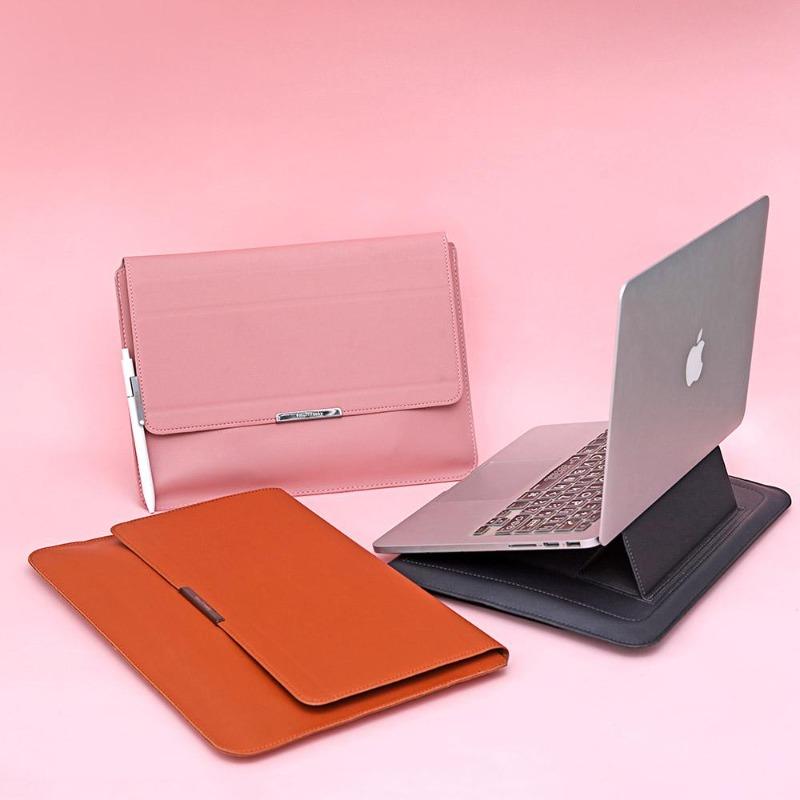 Vegan leather laptop sleeve in pink, gray, and brown