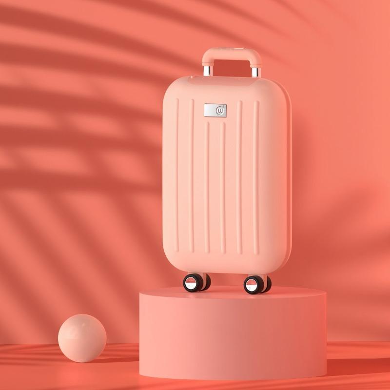 Cute traveler power bank with hand warmer, shaped like a suitcase in pink on a platform